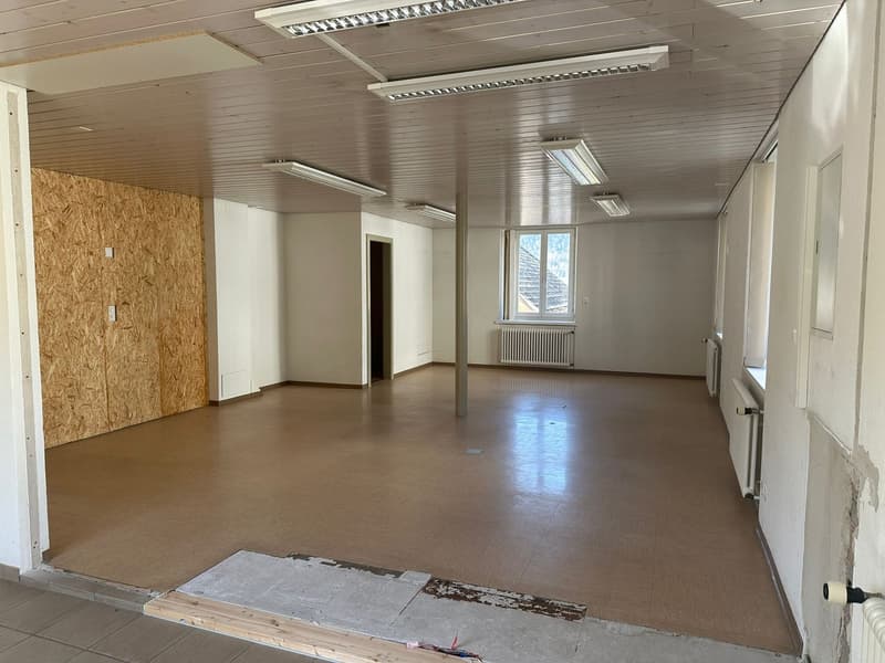 empty room, wooden ceiling, tiled floor, white walls, windows, radiators, unfinished wall