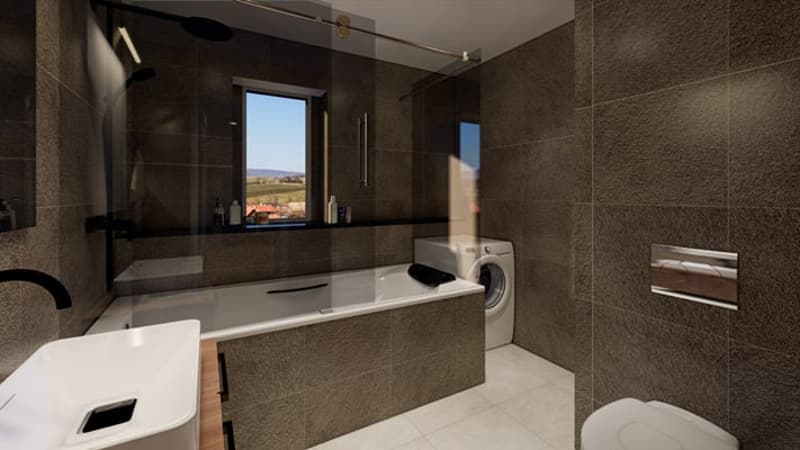 Large bathroom with dark tile walls, a bathtub, a washing machine, and a vanity with a mirror. The bathroom has a window with a scenic view outside.