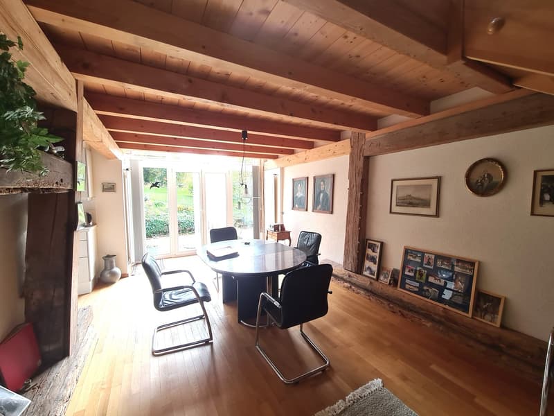 wooden floor, wooden beams, dining table, fireplace, round table, chairs, glass doors, outside garden