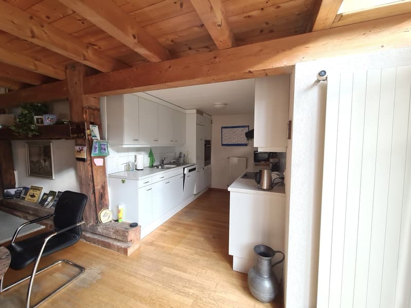 kitchen, dining area, wooden ceiling, white cabinets, sink, radiator