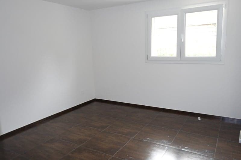 empty room, white walls, wooden tiles, window, outlet