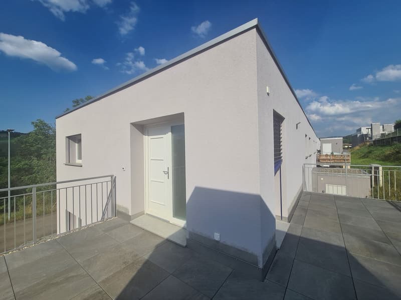 White house, tiled roof, white entrance door, white exterior walls, metal railings, balcony