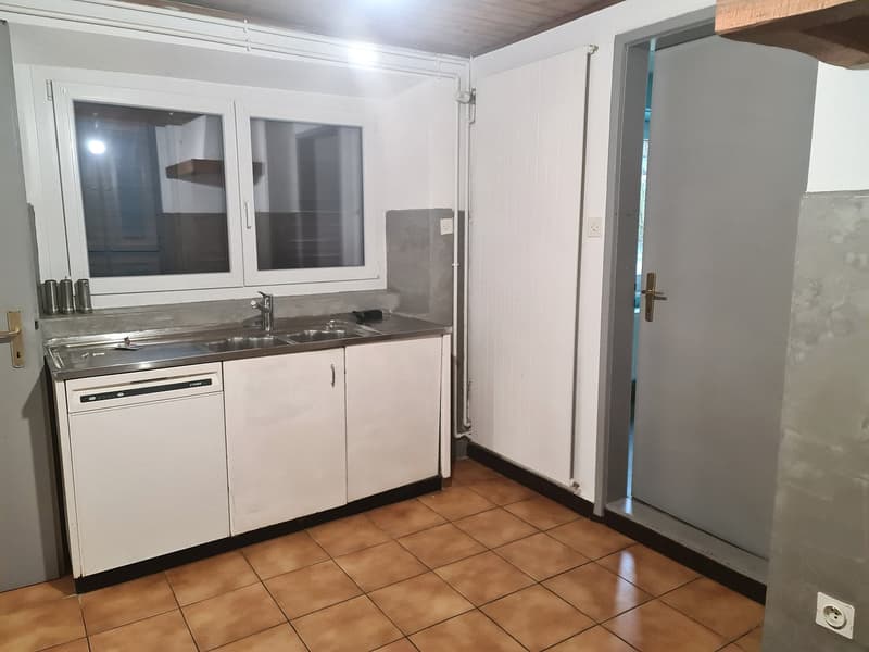 white cabinets, tiled floor, sink with faucet, dishwasher, window