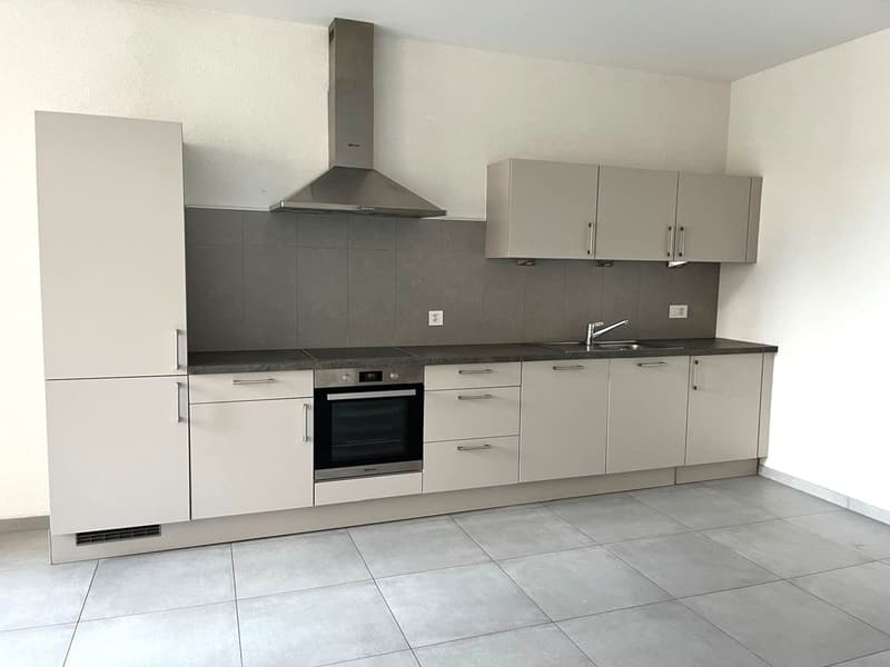 white cabinets, stainless steel oven, extractor hood, sink, tiled floor