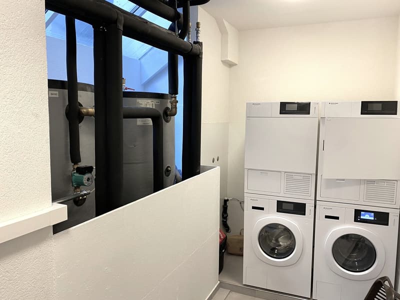 2 washing machines and 2 dryers, water tanks, ventilation