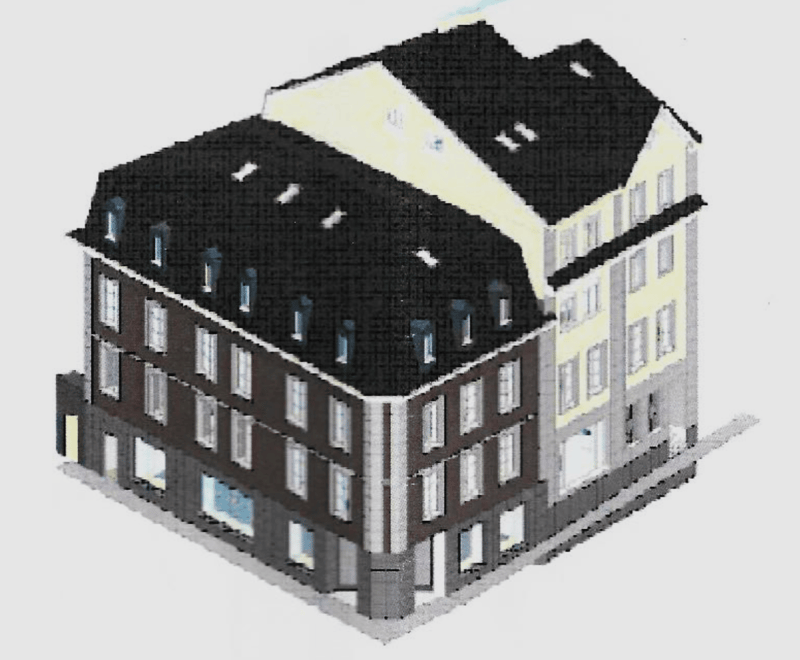 The building is a multi-story commercial establishment with multiple windows and what appears to be a penthouse unit at the top.