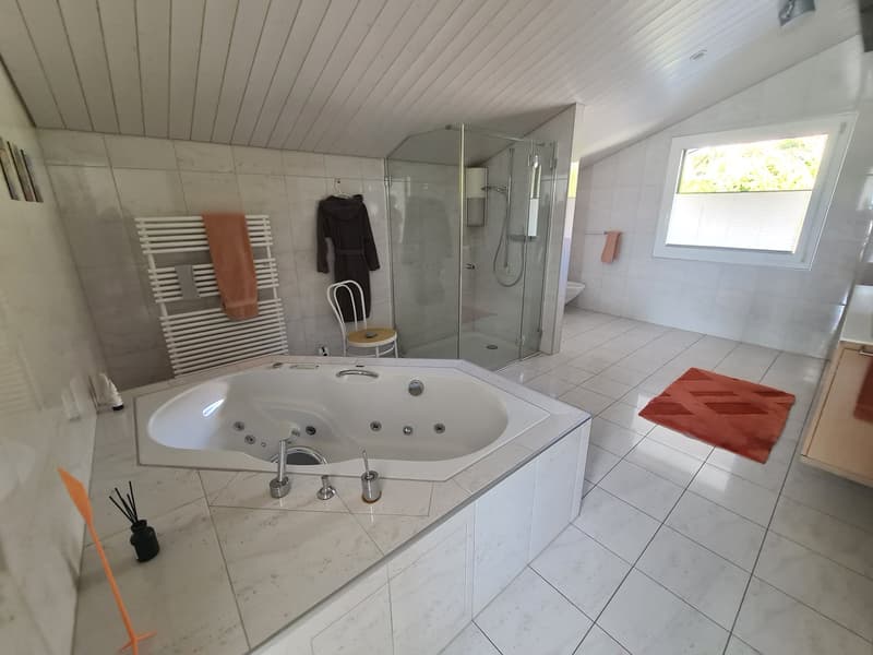 modern white tiled floor, walk-in shower, Jacuzzi tub, washing machine in corner