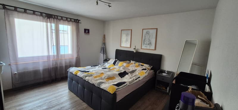 double bed, nightstand, mirror, radiator, large window, storage box, paintings, umbrella