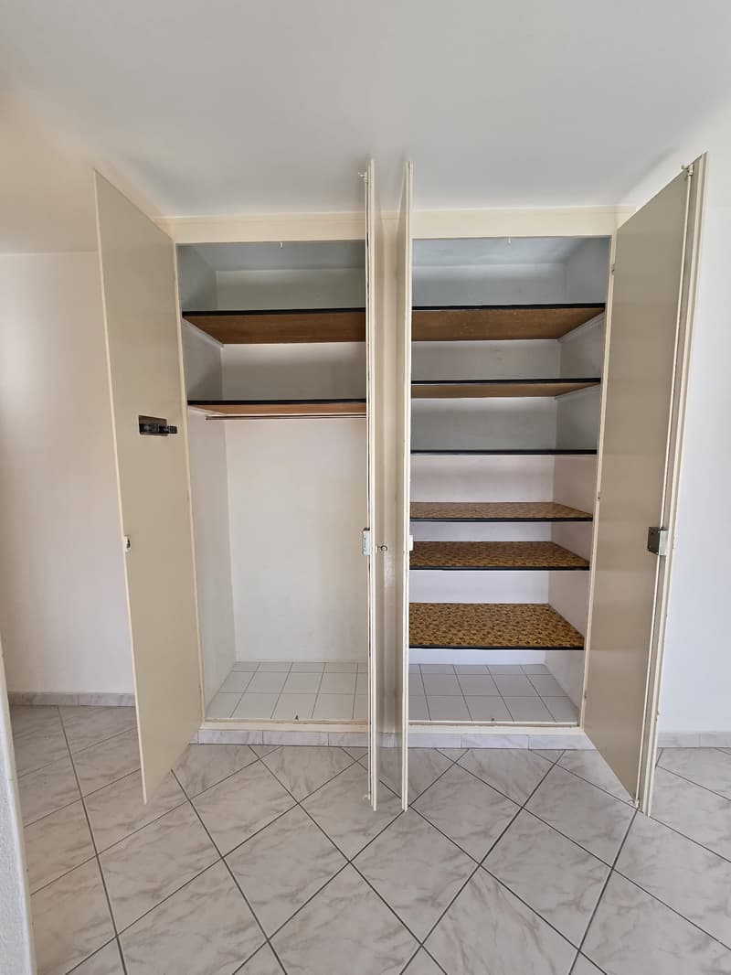 Large double wardrobe with wooden interior compartments