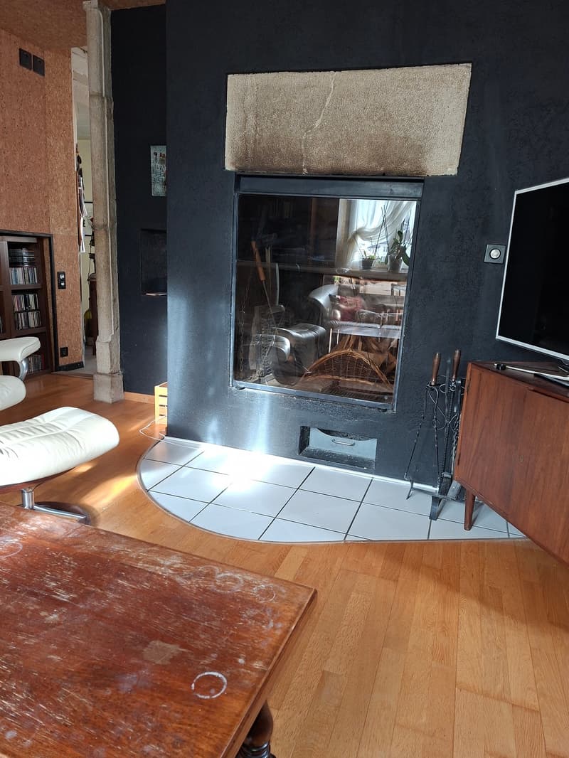 fireplace, living room, wooden floor, white chair, center table, tv stand