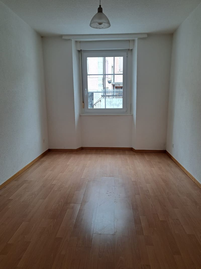 empty room, wooden floor, white walls, window, ceiling lamp