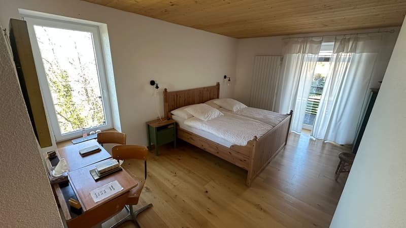 Double bed, Desk, Chairs, Lamps, Glass window, Wooden floor