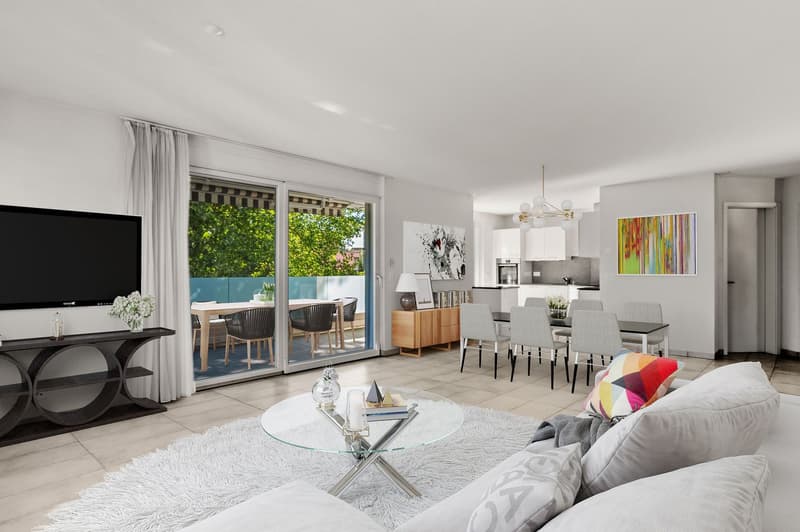 Open-plan living room with sliding glass doors to balcony, white furniture, TV, dining table, modern decor, chandelier, artwork, open kitchen.