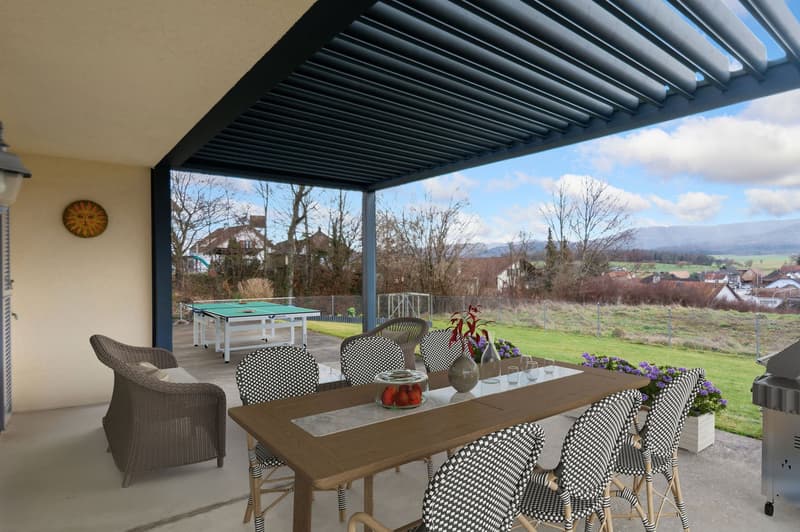 Covered terrace with chairs, table, green table tennis, grill, flowers, wide open view