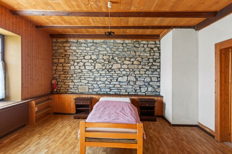 wooden floor, wooden wall, stone wall, bed, nightstands, radiator, window