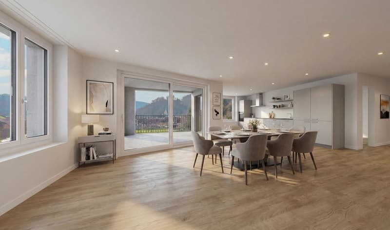 Dining room with wooden floor, large windows, sliding glass doors leading to a balcony, dining table with chairs, kitchen area with cabinets and appliances, artwork on the wall, and a view of the mountains.