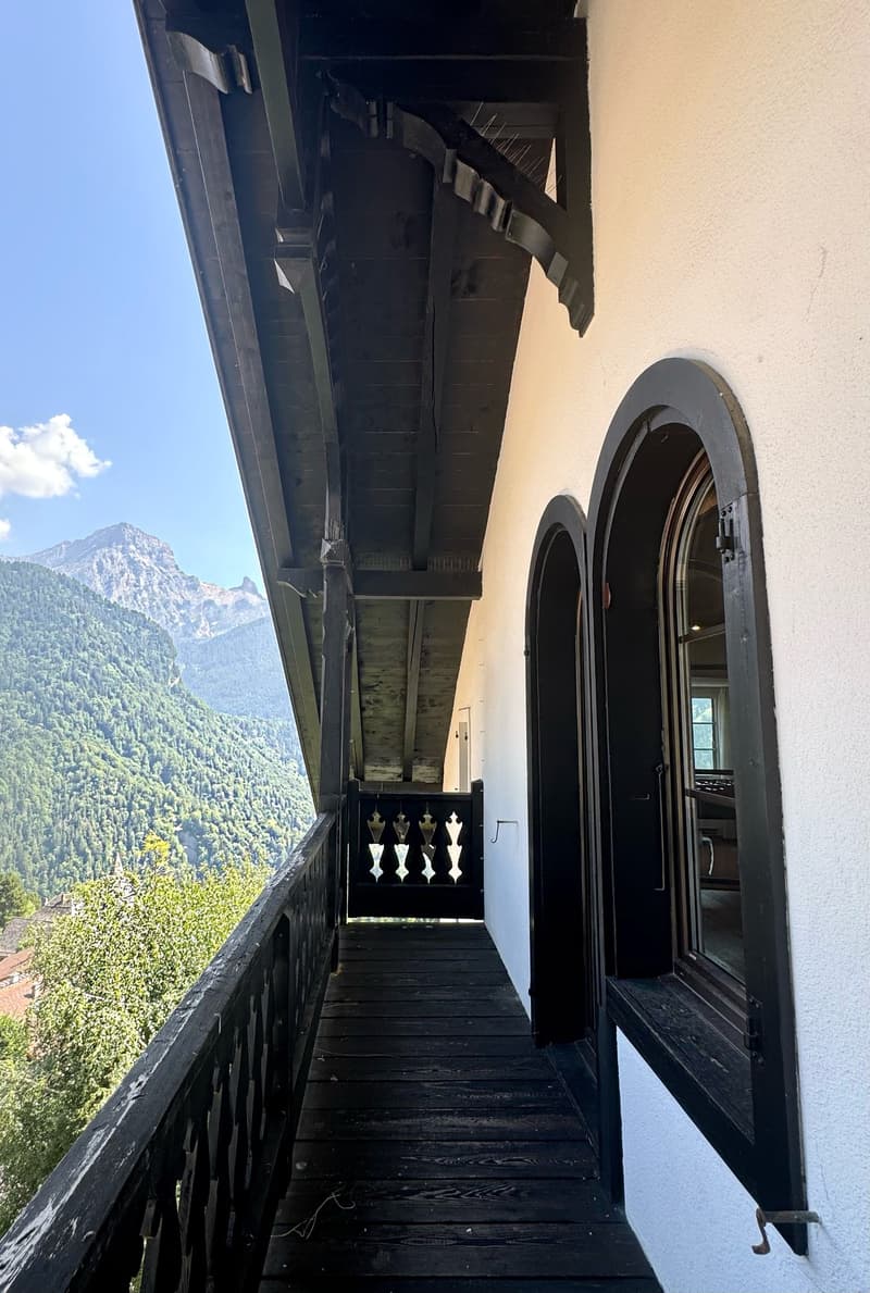 balcony, wooden flooring, fence railing, open view to mountains