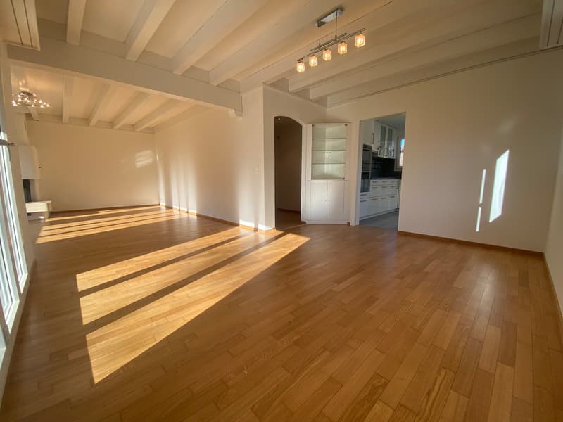 hardwood floors, high ceiling, wooden beams, large windows, kitchen entrance