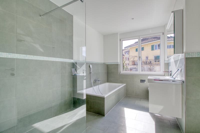 modern bathroom, bathtub, walk-in shower, green tiles, white tiles, white sink, window