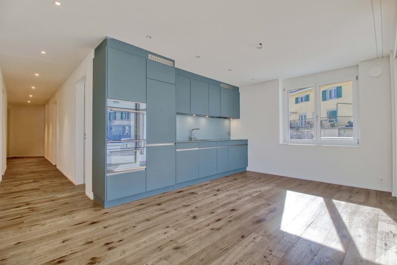 empty room, kitchen, wooden floor, blue cabinets, open windows, sink, faucet, built-in oven