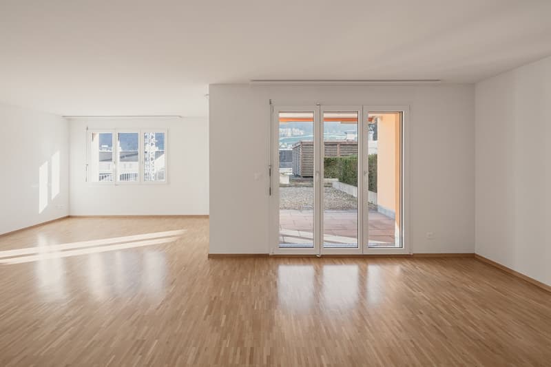 Musterwohnung Wohnbereich mit Zugang zum Balkon