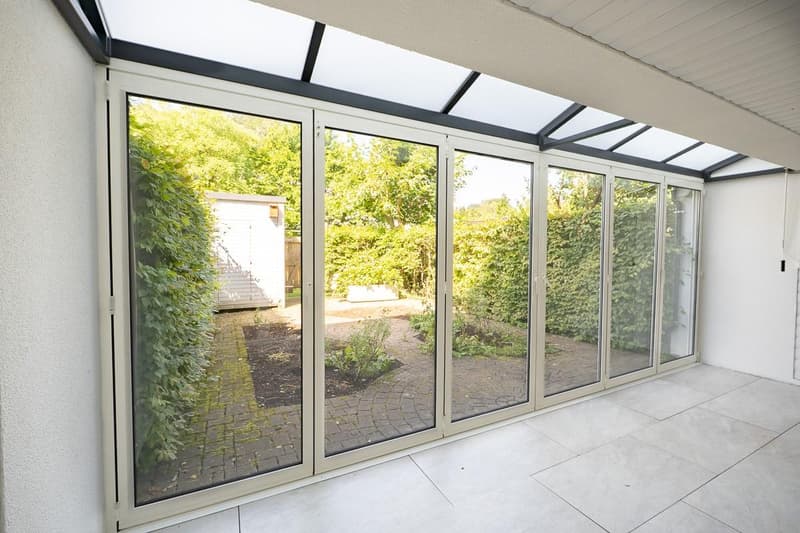 Wohnzimmer mit Wintergarten