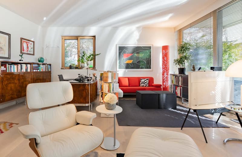 modern living room, white leather armchairs, black carpet, red sofa, large windows, wooden bookshelves, abstract painting
