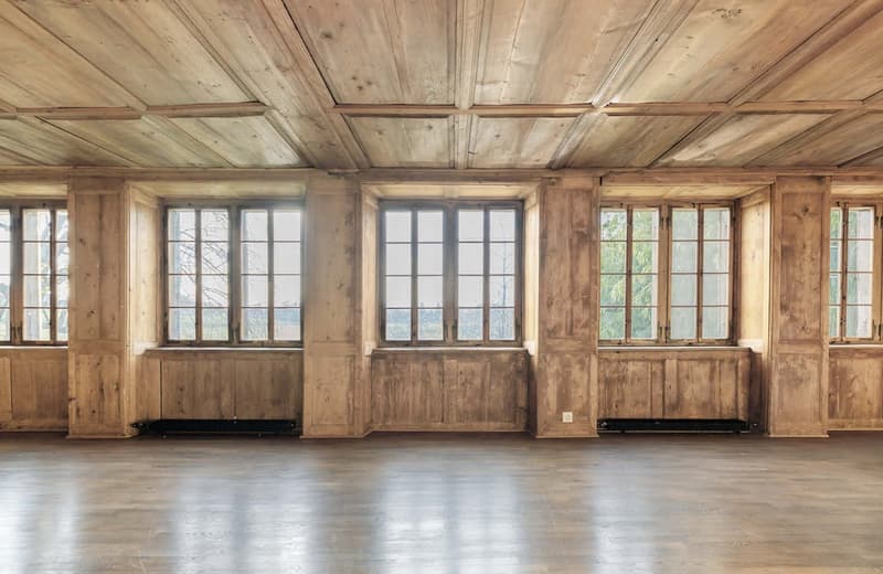 wooden ceiling, wooden walls, hardwood floor, large windows