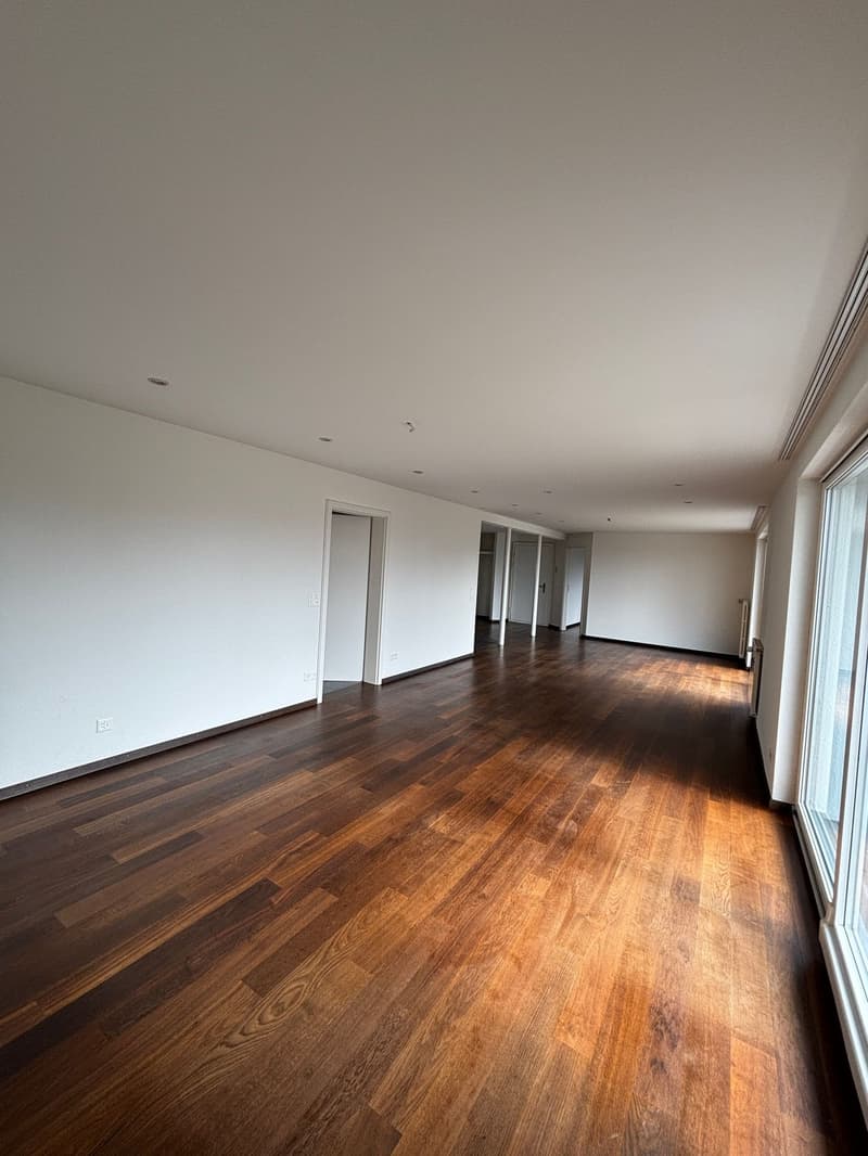 empty room, hardwood floors, white walls, large windows, doors