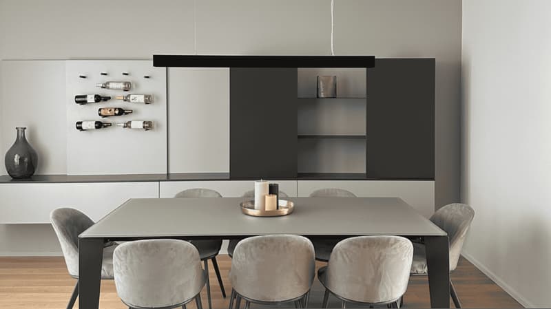 Dining room: Dining table, chairs, wine racks, cabinet, vase, candle
