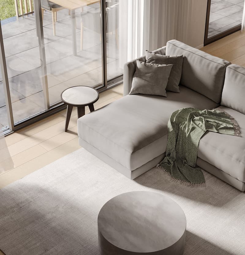 Sofa with pillows, coffee table, round table, glass wall, wooden floor, terrace, view of lawn