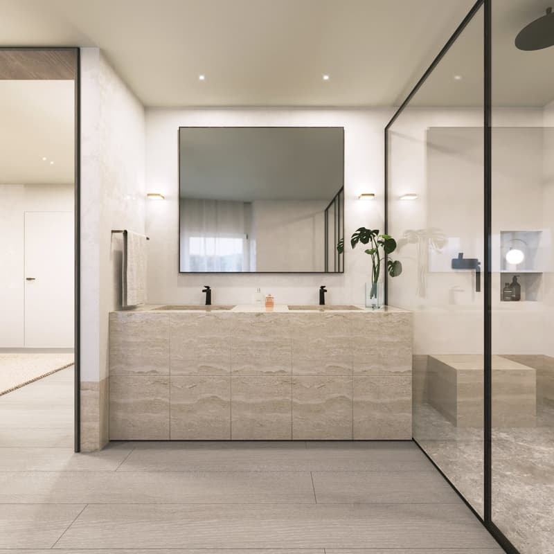 Large vanity with double sinks, marble tiles, large mirror, black faucets, floating shelves, potted plant, shower area