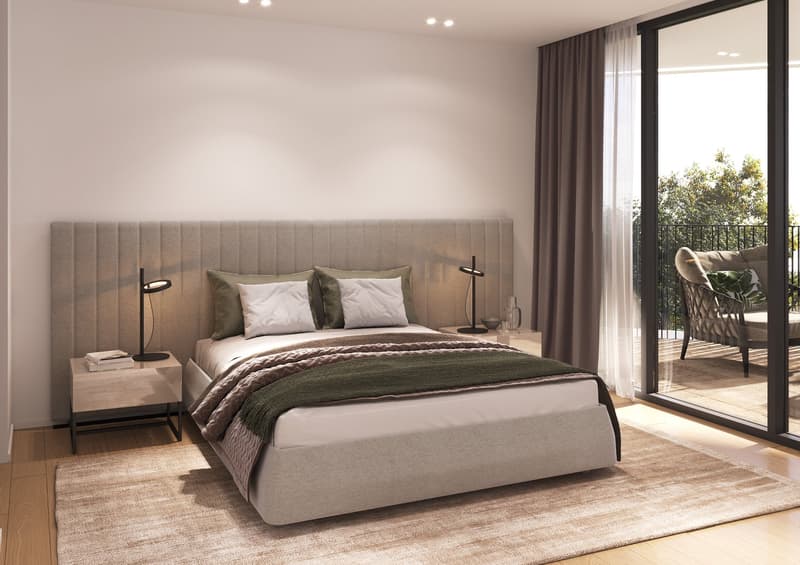 Bedroom with a bed, nightstands, lamps, rug, and a balcony with a chair and railings