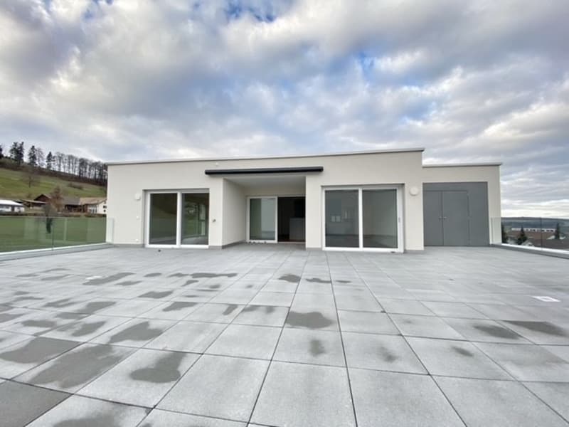 modern house, white exterior, large glass windows, open terrace, gray tiled floor