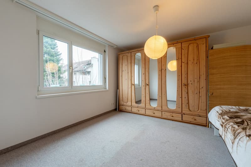 empty room, carpet floor, wooden wardrobe with mirror, window