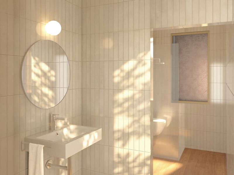 Bathroom with white tiles, round mirror, white sink, white towel, white toilet, glass shower door, wooden floor