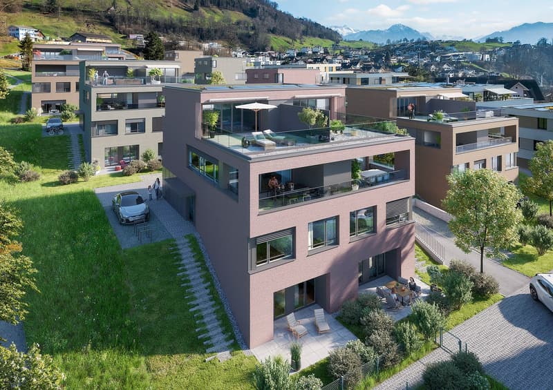 3 story residential building, pink walls, solar panels, balconies, outdoor lounge area