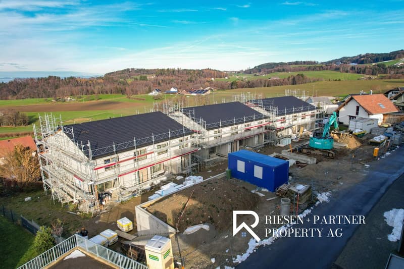 New build houses in construction, surrounded by landscape