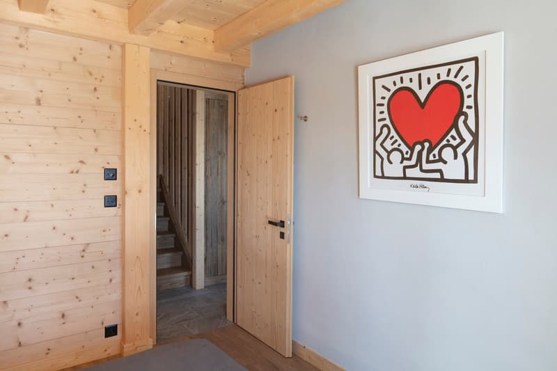 wooden walls, wooden door, white wall, framed art, staircase