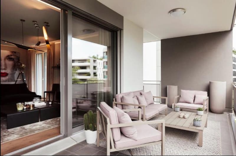 Open balcony with seating, tables, view of the cityscape, indoor living area with furniture