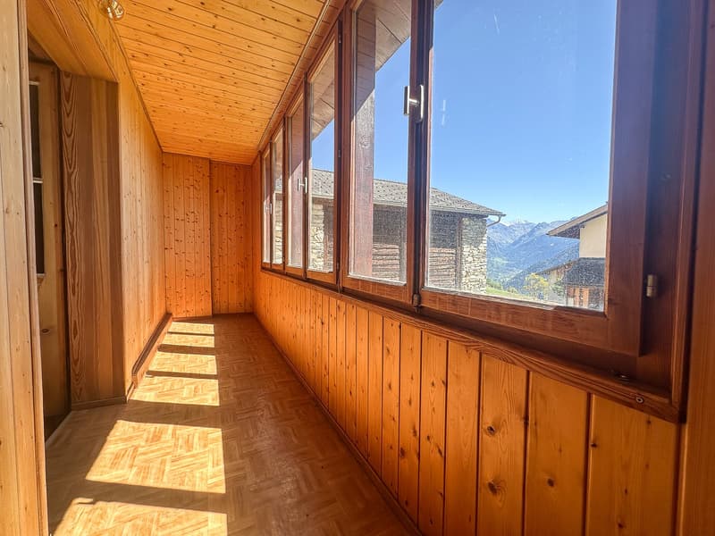 wooden wall, large windows, wooden floor, mountain view