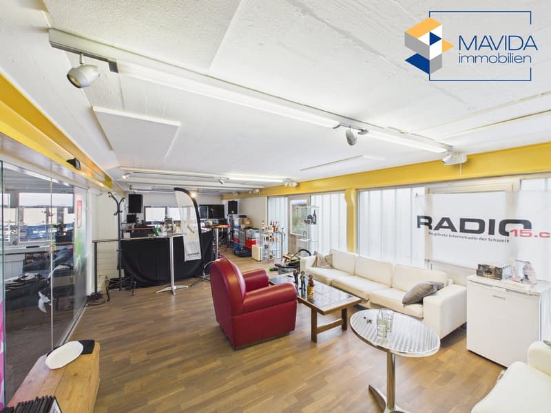 wooden floor, white ceiling, large windows, multiple furniture items