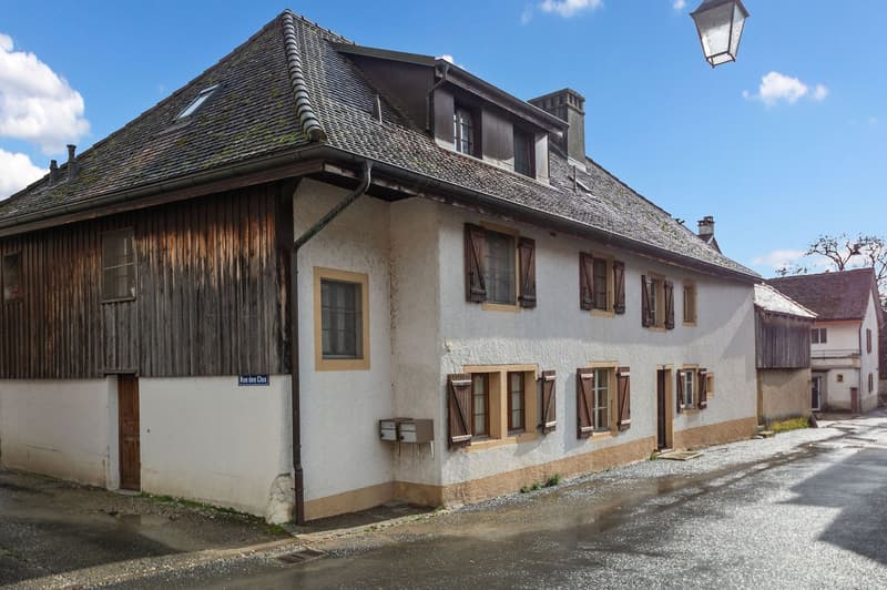 2 story house, wooden exterior, white walls, multiple windows, brown doors, chimney, mailbox