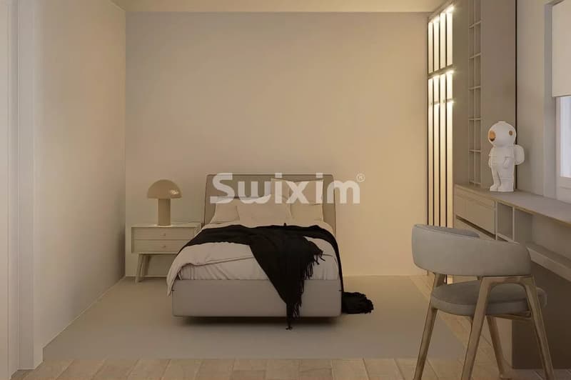 Chambre lumineuse et moderne avec un lit confortable et une décoration épurée.