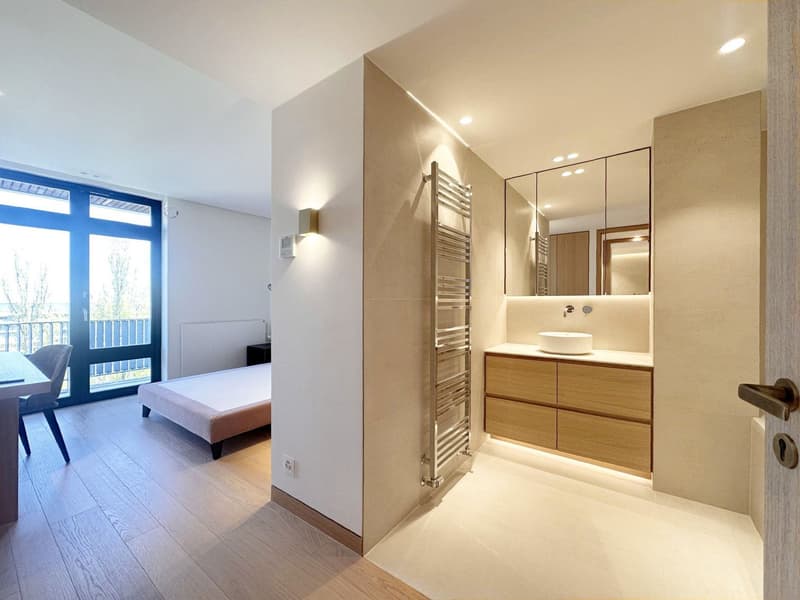 Bathroom with sink, mirror, towel rack, and a balcony with a view