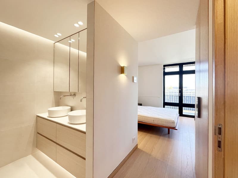modern bathroom with double sink, mirror, wooden floor, large window with view