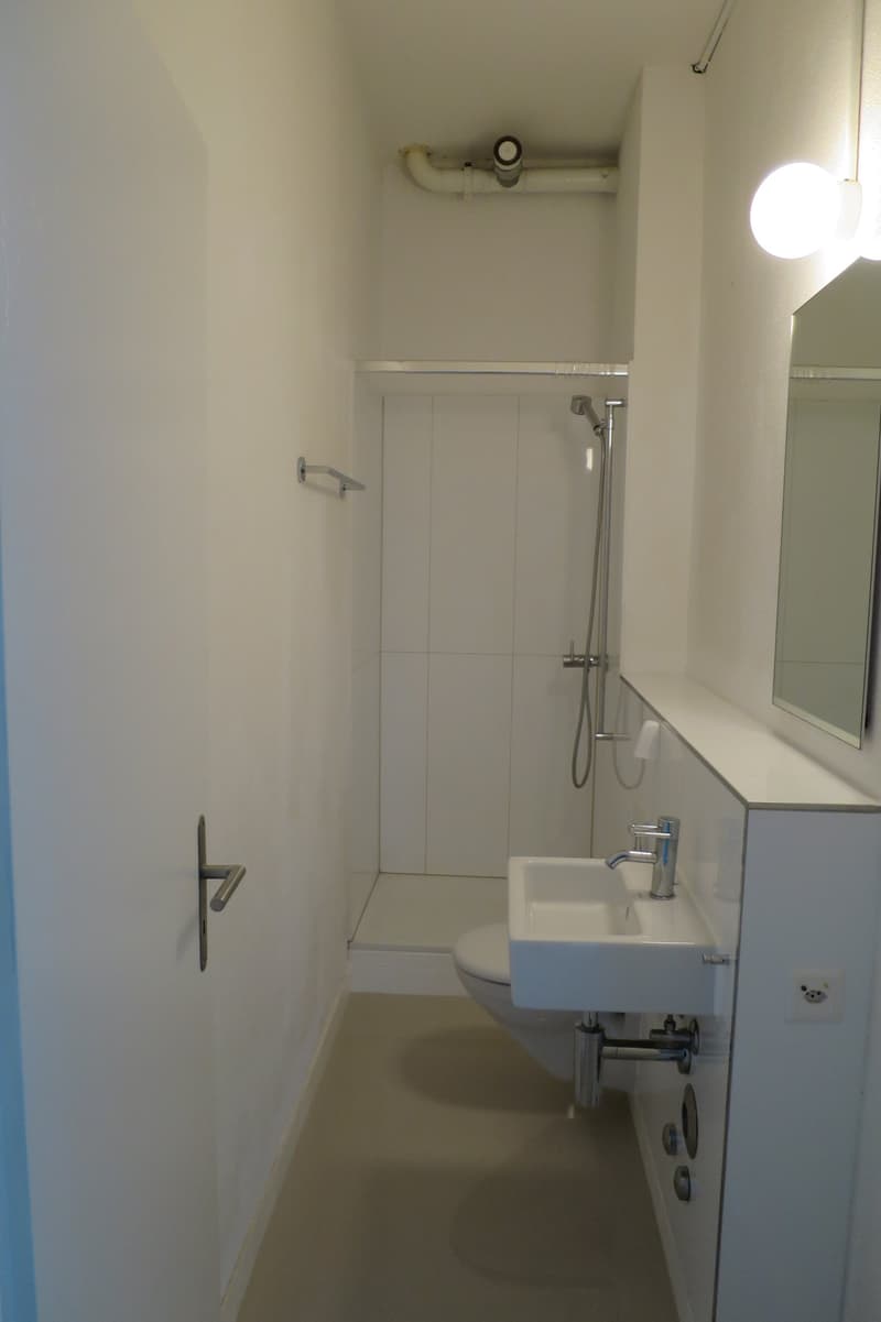 Empty bathroom with modern fixtures and shower