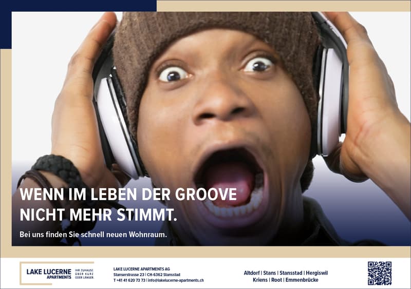 A person wearing headphones with an open mouth.