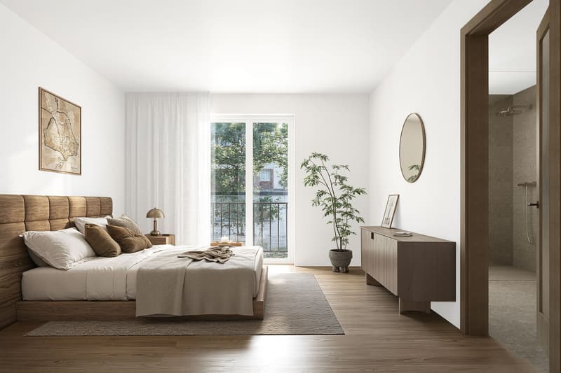 wooden floor, large bed, wooden nightstand, round mirror, potted plant, shower