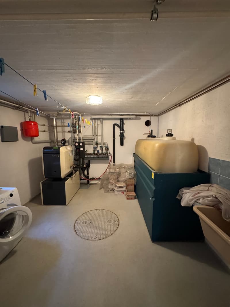 Laundry room with white washing machine and washing machine